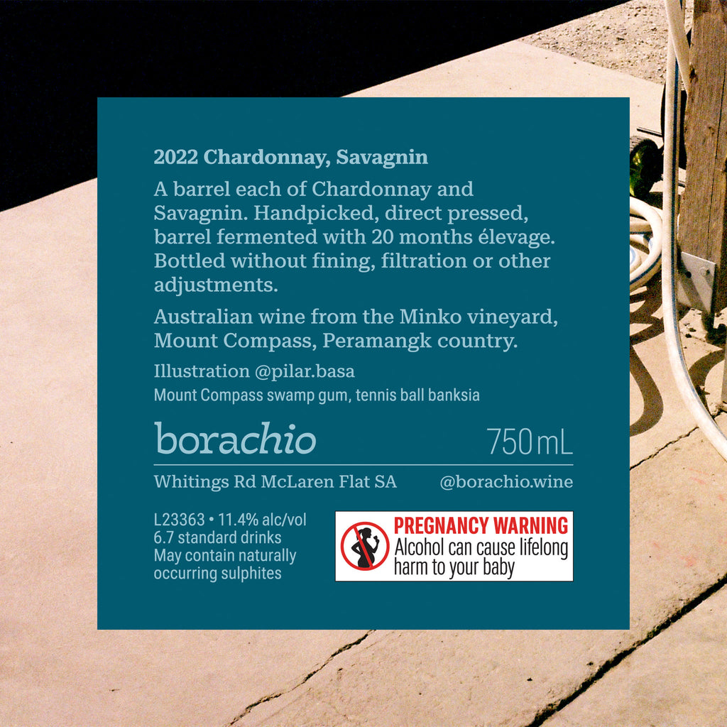 Borachio Chardonnay Savagnin 2022 750 mL, back label. Dark Teal in colour, information includes wine details and a pregnancy warning.